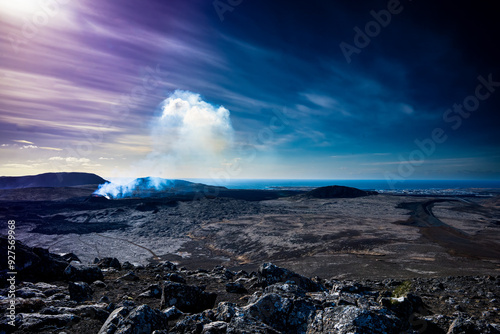 Smoke over volcanic crater at dawn