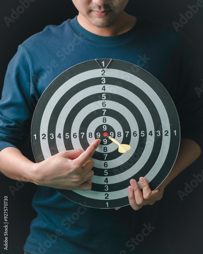 Obraz na płótnie target management concept, person pointing on the target, the target center business planning process success in 2025. w salonie
