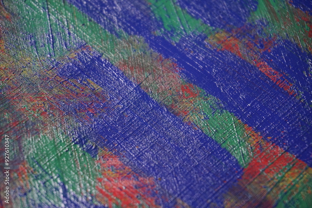 Mixed rough paint splatter on a textured blue paint surface, Grungy colorful paint brush strokes backdrop, Abstract multicolor paint splash background Mixed rough paint splatter on a textured blue paint surface, Grungy colorful paint brush strokes backdrop, Abstract multicolor paint splash background