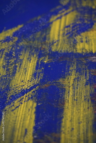 Abstract yellow paint brush splatter on a blue texture surface, Vintage yellow paint stroke pattern on a dark blue background, Colorful grungy paint splash backdrop