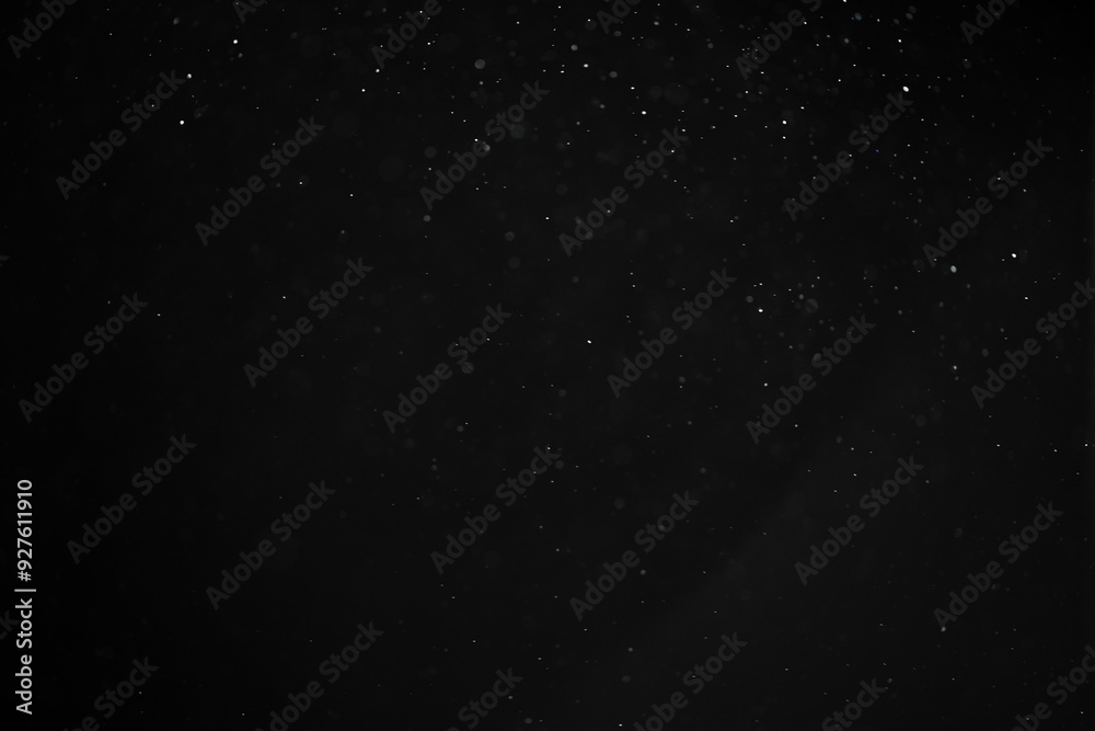 abstract real dust floating over black background for overlay abstract real dust floating over black background for overlay