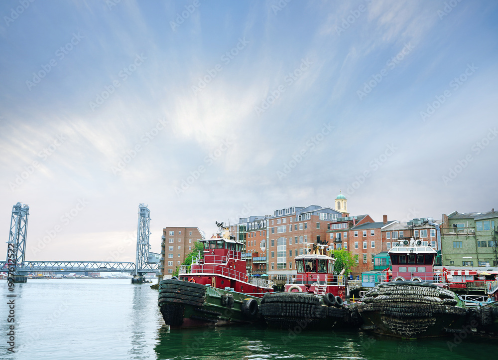 View of boats on the Piscataqua River in historic downtown Portsmouth New Hampshire View of boats on the Piscataqua River in historic downtown Portsmouth New Hampshire