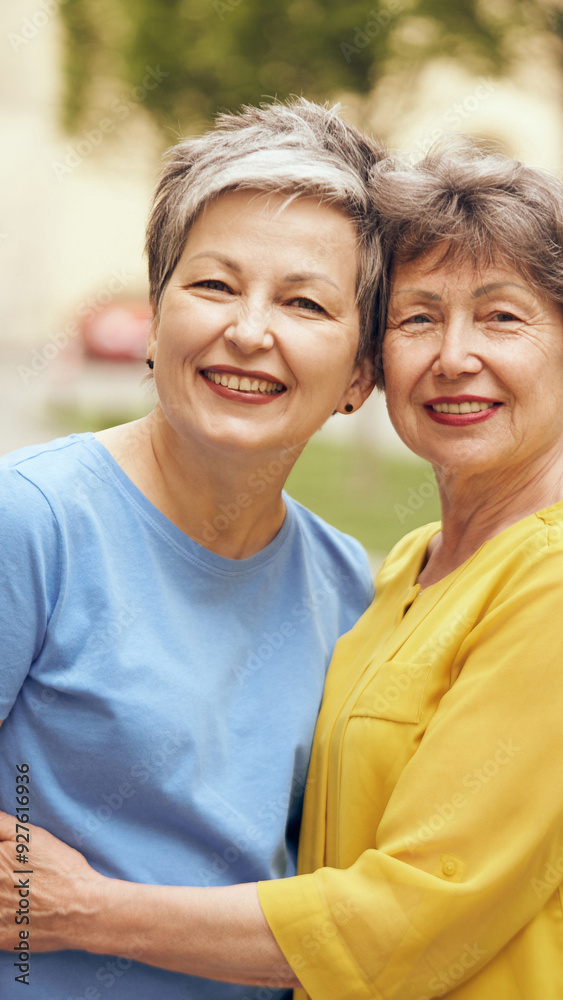 Joyful Senior Women Embracing and Enjoying Their Time Outdoors Together in Nature Joyful Senior Women Embracing and Enjoying Their Time Outdoors Together in Nature