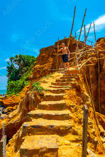 Parrot Rock on tropical paradise beach Mirissa Beach Sri Lanka. photo