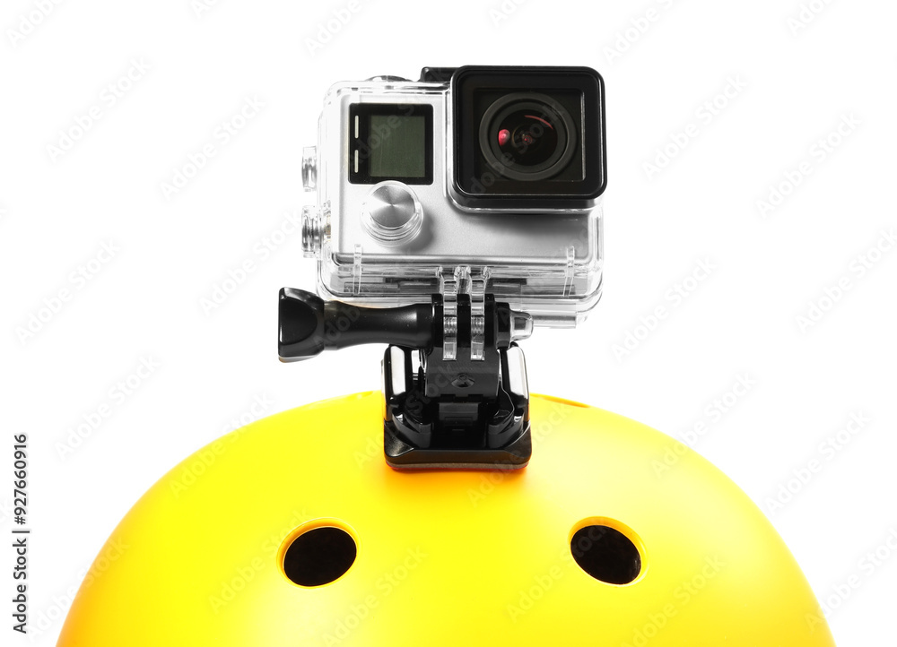 Modern action camera on helmet against white background Modern action camera on helmet against white background