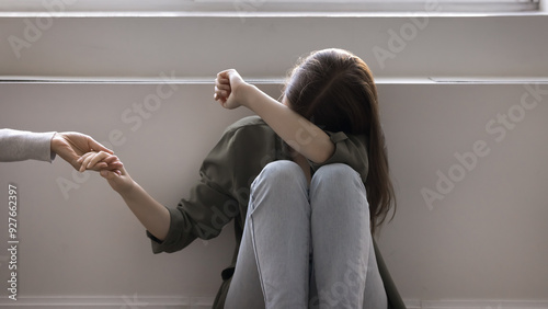 Fotografi Upset teen accept loving parent help, holding mothers hands, get psychological support in difficult life situation, adolescence problems, bullying in school