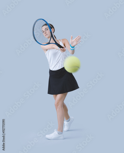 Young tennis player hitting a forehand