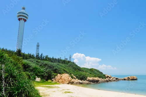 beautiful tropical landscape of Mulan lighthouse and sea & ocean at Mulan Bay, Wenchang, Hainan, China photo