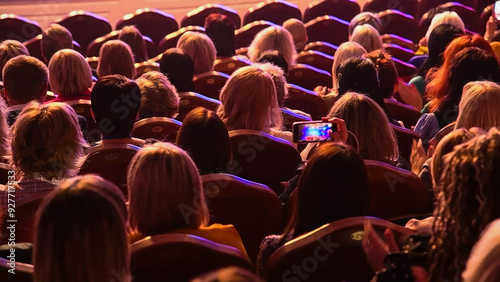 The people enjoying the singer on the stage