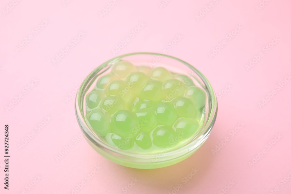 Bright tapioca pearls in bowl on pink background, closeup Bright tapioca pearls in bowl on pink background, closeup