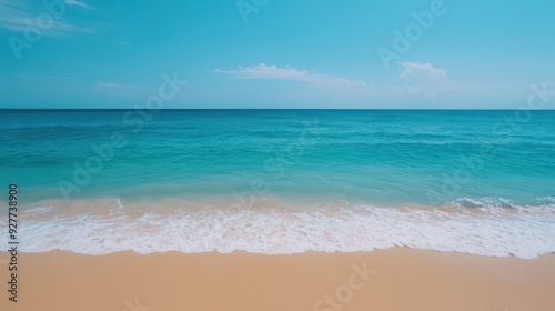 Tranquil beach scene featuring golden sand, clear blue water, and a serene sky, perfect for relaxation and vacation vibes.