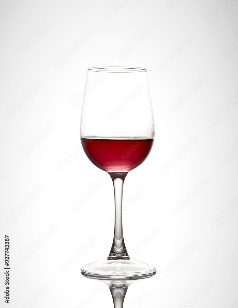 glass of red wine on white gradient background glass of red wine on white gradient background