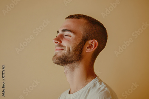 A close up of a man's face with his eyes closed