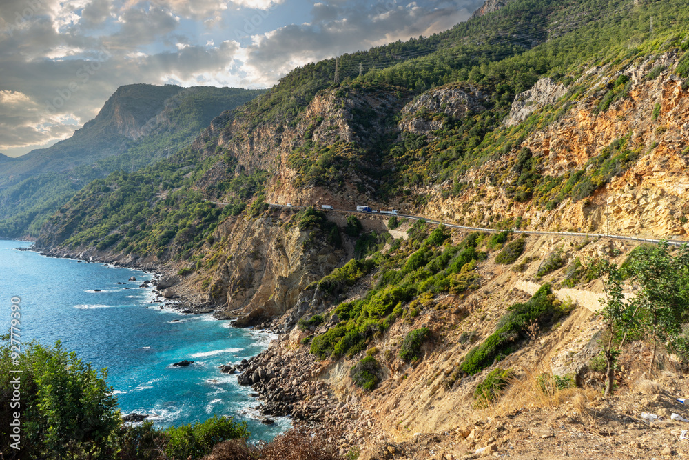 Vehicle road in the mountains descending perpendicularly to the sea between Alanya and Anamur in the Mediterranean Vehicle road in the mountains descending perpendicularly to the sea between Alanya and Anamur in the Mediterranean