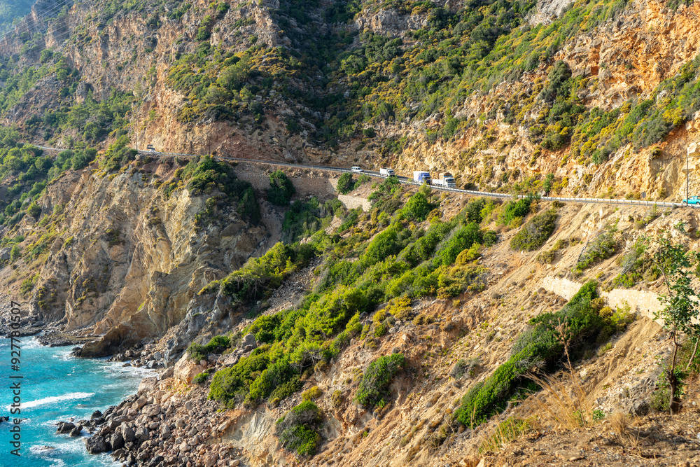 Vehicle road in the mountains descending perpendicularly to the sea between Alanya and Anamur in the Mediterranean Vehicle road in the mountains descending perpendicularly to the sea between Alanya and Anamur in the Mediterranean