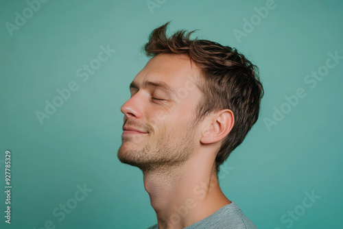 A close up of a man's face with his eyes closed