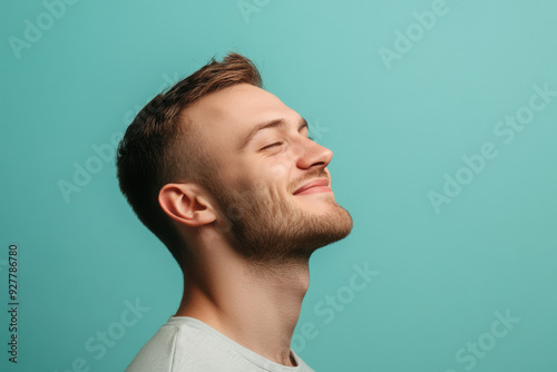 A close up of a man's face with his eyes closed