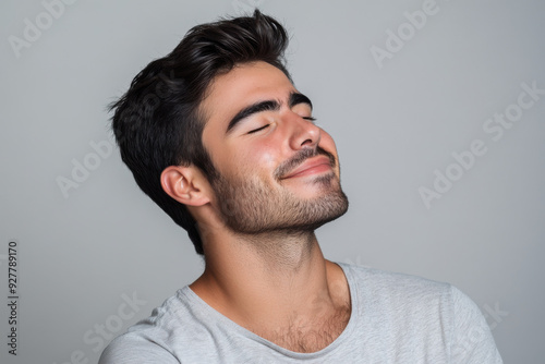 A close up of a man's face with his eyes closed