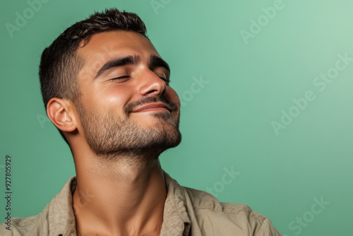 A close up of a man's face with his eyes closed