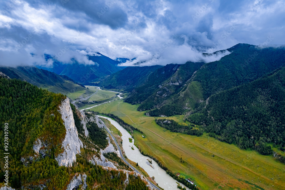 Fototapeta premium Aerial top view beautiful landscape mountains with fog, green forest and trees in rural Altai, drone photo