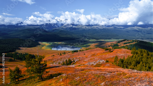 Autumn landscape Altai yellow forest crystal clear lake and mountain, aerial view. Concept adventure trip in nature photo