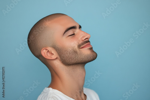 A close up of a man's face with his eyes closed