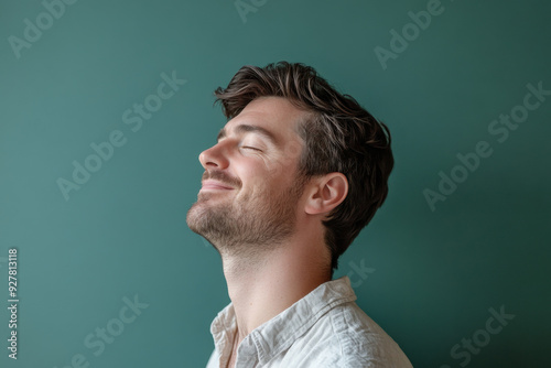 A close up of a man's face with his eyes closed