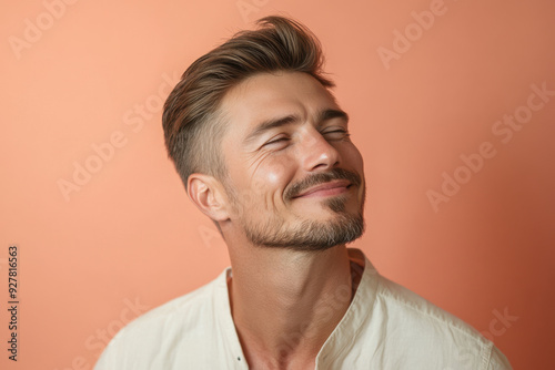 A close up of a man's face with his eyes closed