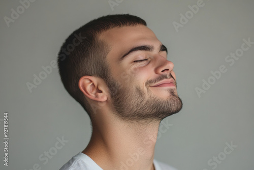 A close up of a man's face with his eyes closed