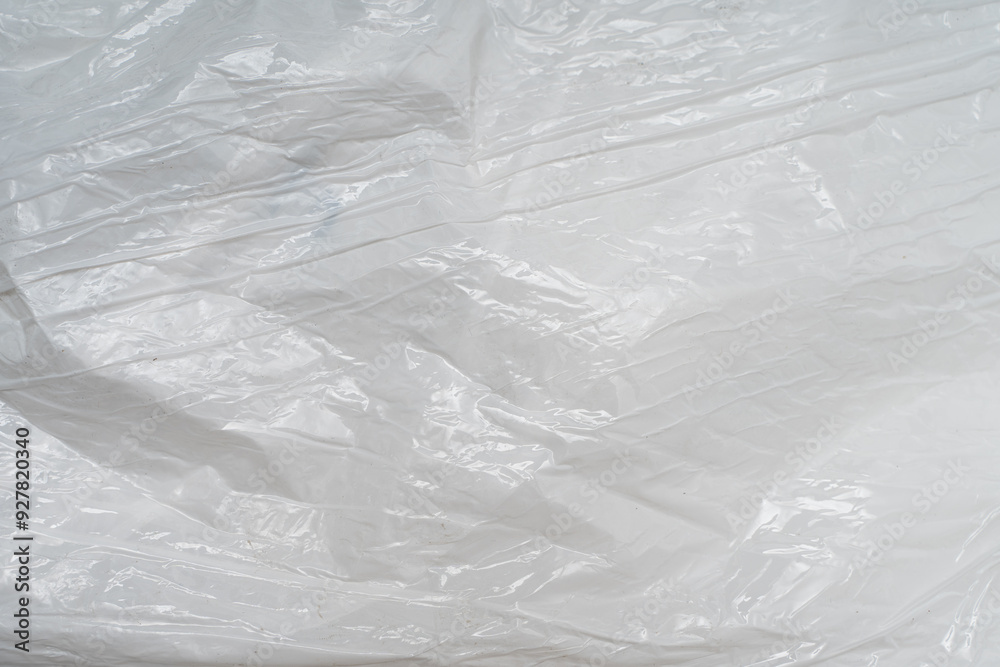 Turquoise Crumpled PE Film Texture, Close-Up Film, Background Design. Hazardous material for the environmental concept Turquoise Crumpled PE Film Texture, Close-Up Film, Background Design. Hazardous material for the environmental concept