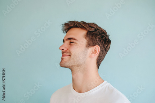 A close up of a man's face with his eyes closed