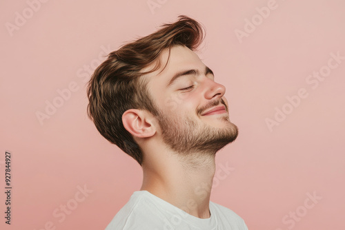 A close up of a man's face with his eyes closed