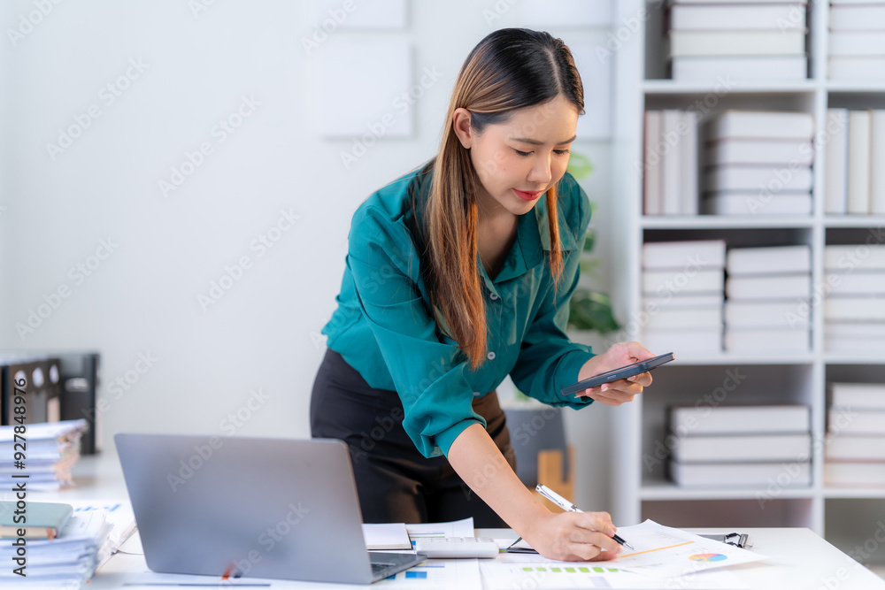 Focused Female Executive Analyzing Financial Data Focused Female Executive Analyzing Financial Data
