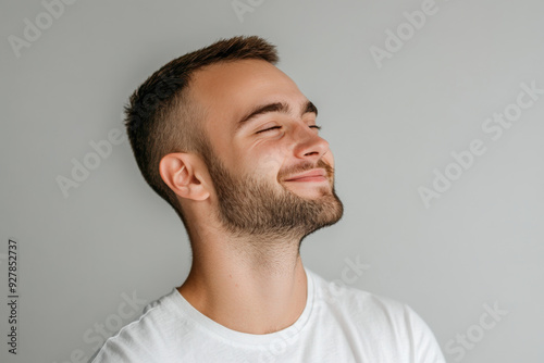 A close up of a man's face with his eyes closed