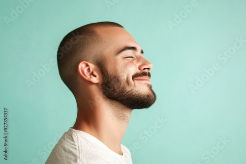 A close up of a man's face with his eyes closed