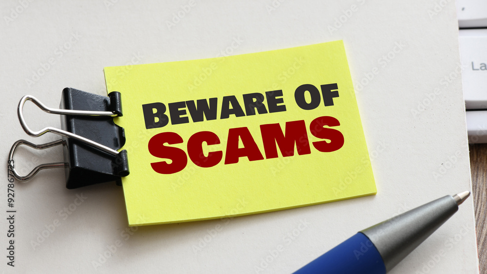 Beware Of Scams words in an office notebook. Beware Of Scams words in an office notebook.