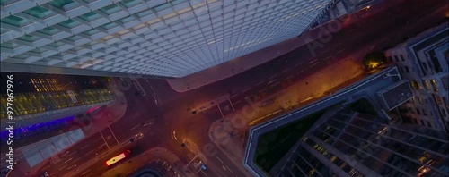 
As the sun begins to set over London, the city's iconic skyline is bathed in a warm, golden glow. From a drone's aerial perspective, the skyscrapers rise majestically, their glass facades reflecting 