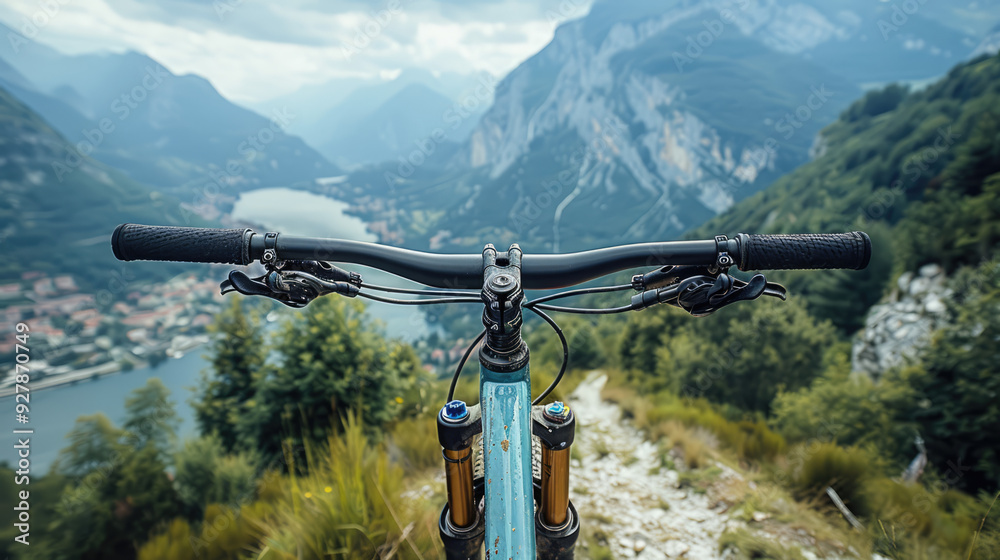 A cyclist on a mountain trail, with breathtaking views and challenging terrain A cyclist on a mountain trail, with breathtaking views and challenging terrain