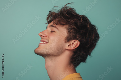 A close up of a man's face with his eyes closed