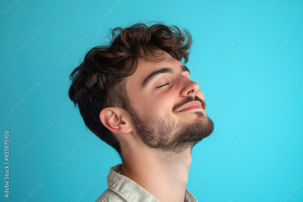 Fototapeta premium A close up of a man's face with his eyes closed