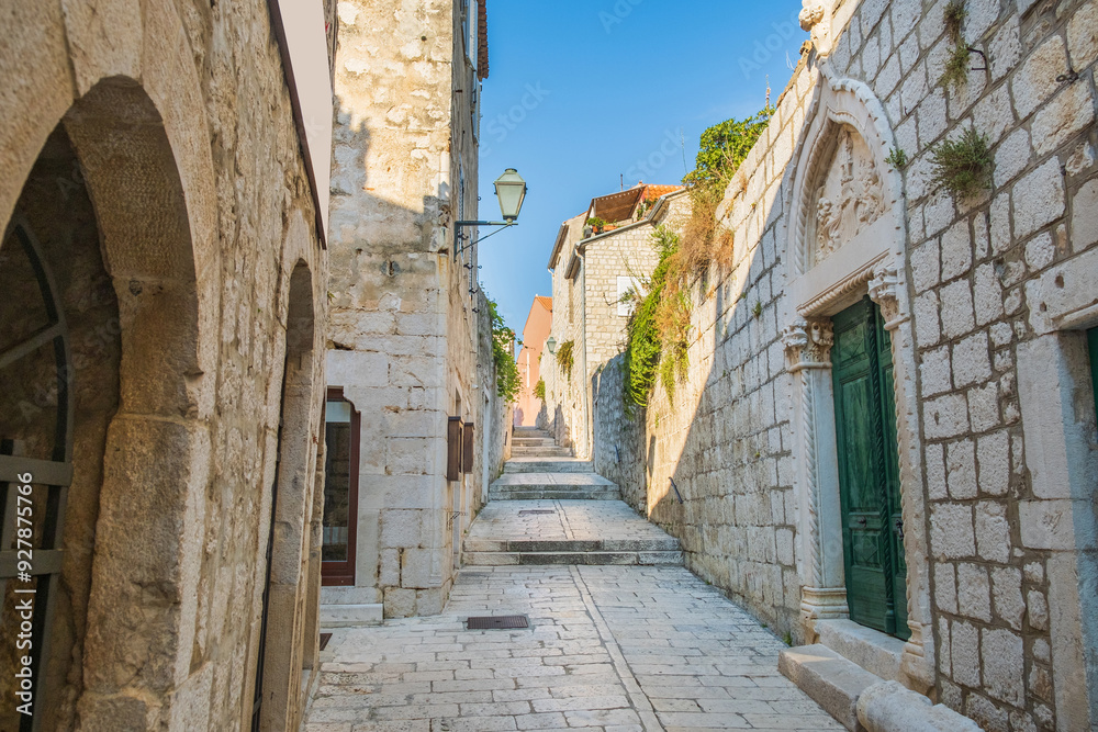 Narrow stone street in town of Rab, Croatia