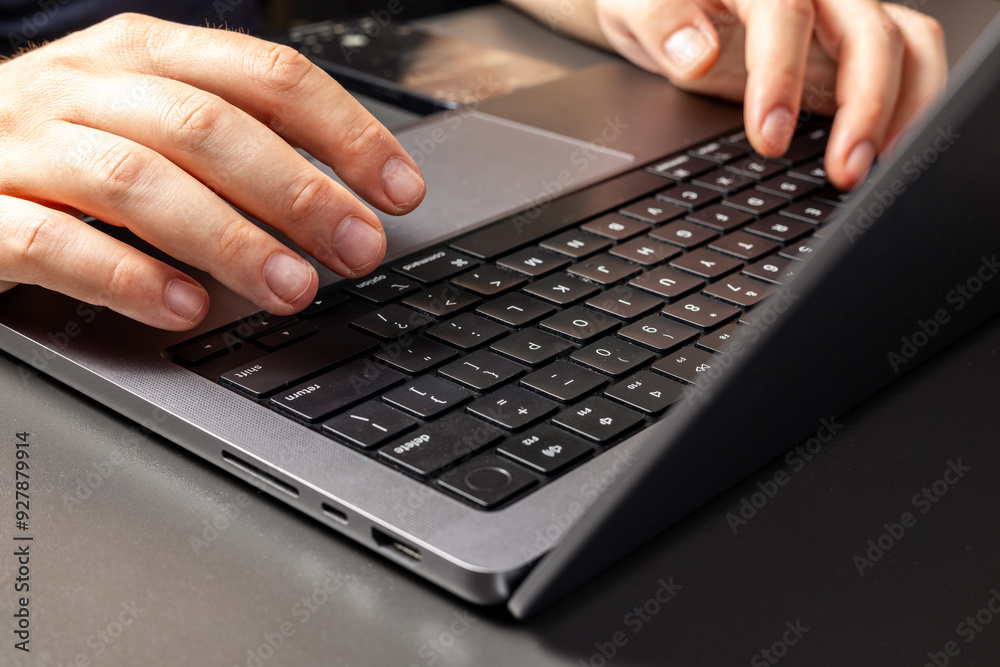 Close up, man hand typing on laptop keyboard. Business man working online on laptop, surfing the internet, searching the information at home office, e-learning. Close up, man hand typing on laptop keyboard. Business man working online on laptop, surfing the internet, searching the information at home office, e-learning.