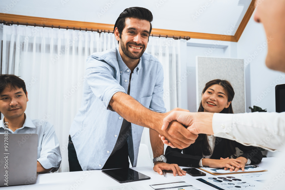 Diverse group of office employee worker shake hand after making agreement on strategic business marketing meeting. Teamwork and positive attitude create productive and supportive workplace. Prudent Diverse group of office employee worker shake hand after making agreement on strategic business marketing meeting. Teamwork and positive attitude create productive and supportive workplace. Prudent