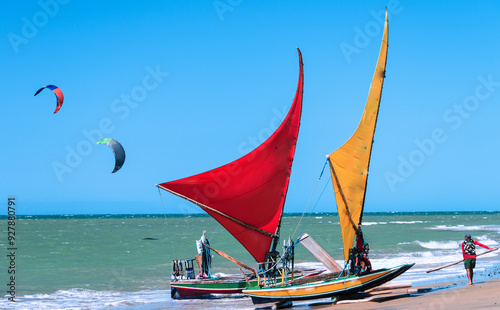 Fototapeta Naklejka Na Ścianę i Meble -  Jangada, or raft, a rustic wooden boat with a sail, typically used for fishing and recently for excursions with tourists. Cumbuco Beach, Fortaleza, CE, Brazil, 2019