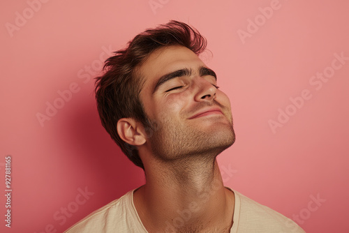 A close up of a man's face with his eyes closed