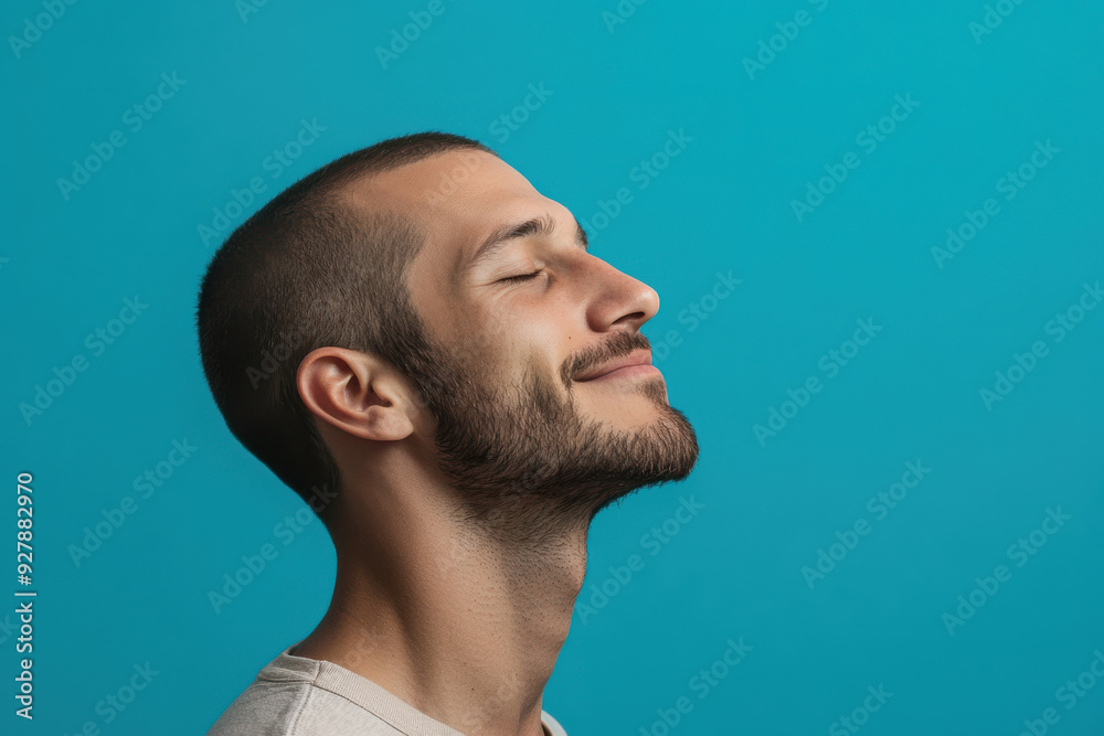 Fototapeta premium A close up of a man's face with his eyes closed