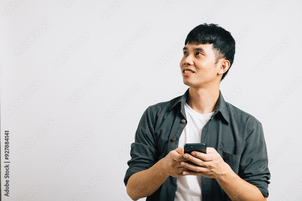Portrait Asian smiling young man holding mobile phone on hand studio shot isolated white background, Happy excited lifestyle businessman using smartphone browsing internet, happiness and enjoyment Portrait Asian smiling young man holding mobile phone on hand studio shot isolated white background, Happy excited lifestyle businessman using smartphone browsing internet, happiness and enjoyment