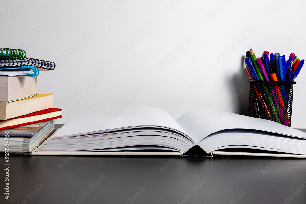 Back to school. Stack of books and pencils on a desk with white background. Back to school. Stack of books and pencils on a desk with white background.