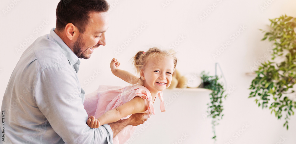 Weekend At Home. Daddy holding his little child, having good time. Panorama, free space Weekend At Home. Daddy holding his little child, having good time. Panorama, free space