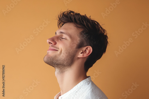 A close up of a man's face with his eyes closed